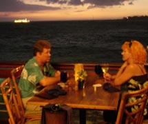 Relax on the deck at Huggos Restaurant in Kailua-Kona on the Big Island Hawaii.