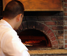 Wood-oven baked pizzas prepared the true Italian way