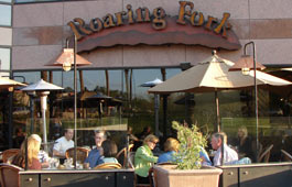 Diners enjoy great cuisine on the wonderful Saloon Patio at the Roaring Fork