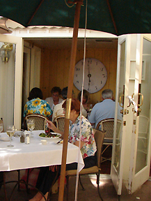 Large antique clock adorns the wall in same private room above