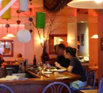 Bask in the rosy glow and comfortable ambience of Duc's Bistro in Honolulu.