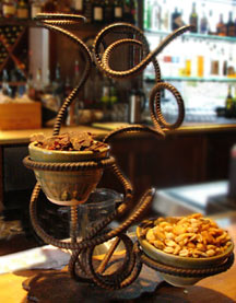 Western-style iron sculpture displays saloon appetizers